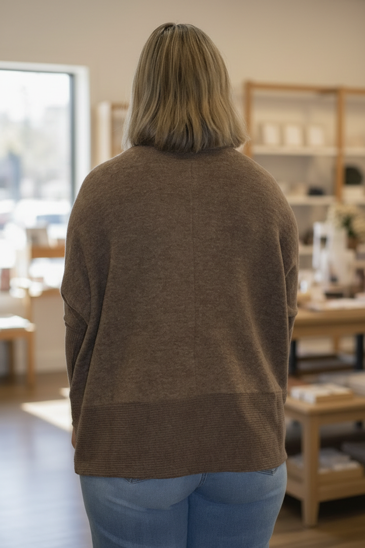 Back view with boutique background