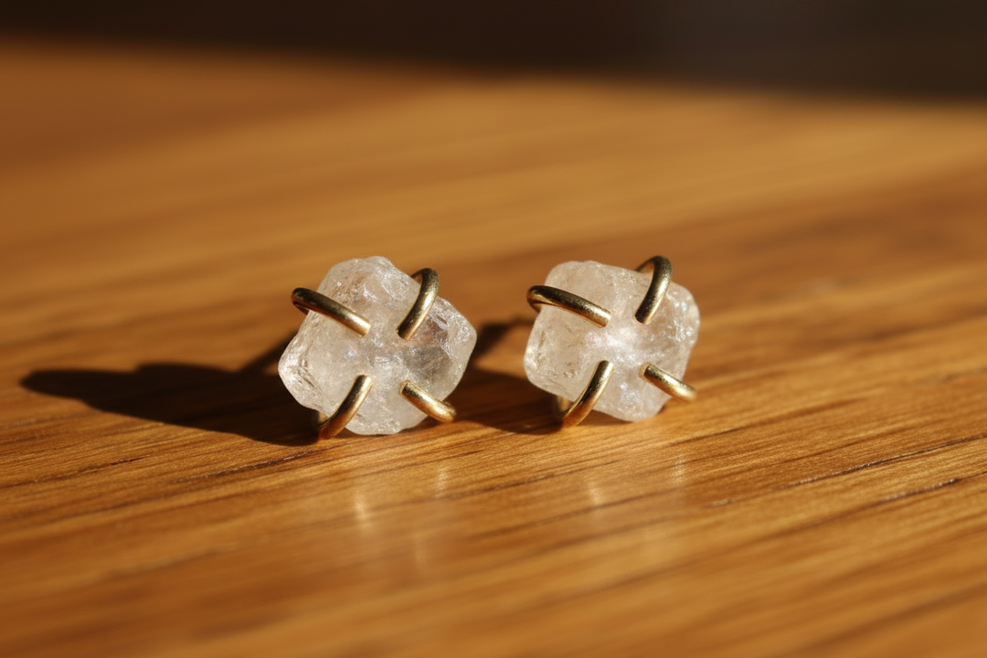 Clear Quartz Stud Earrings on Wood Surface