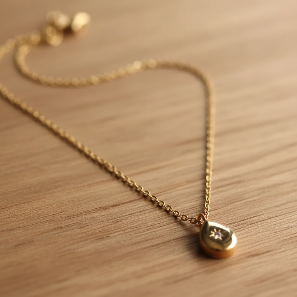 Gold North Star Pendant Necklace - warm wood background
