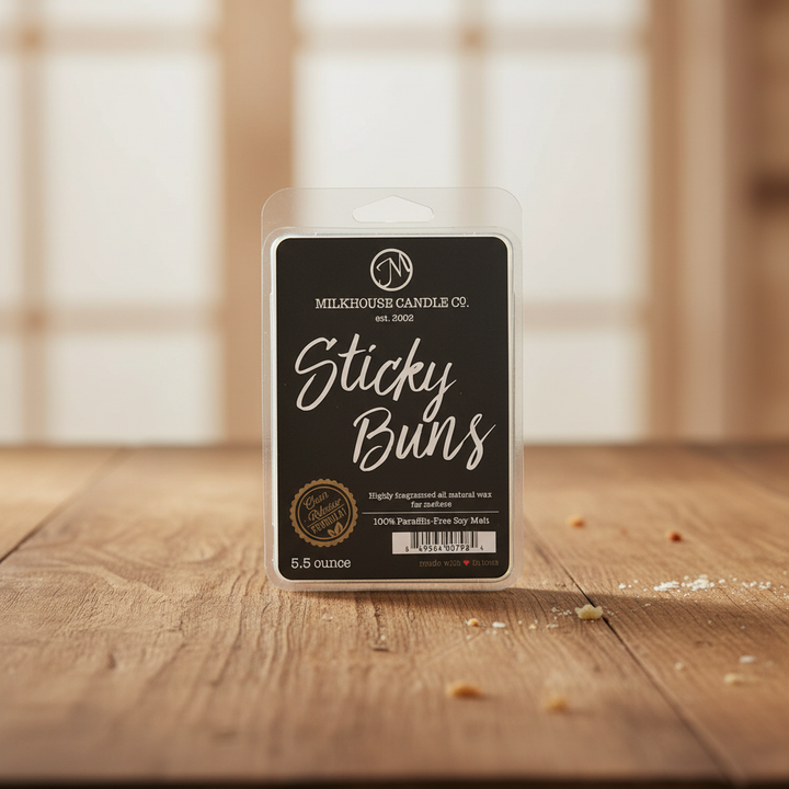 Milkhouse sticky bun 5.5oz wax melt on warm rustic wooden table lifestyle product photography