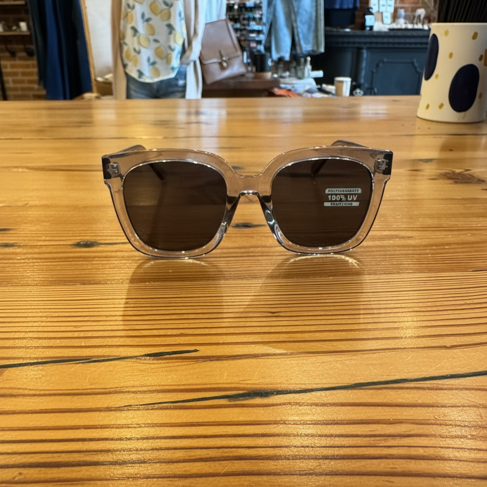 Simple oversized rounded square sunglasses side view on rustic wooden table – Elle & Beck's Lifestyle Boutique