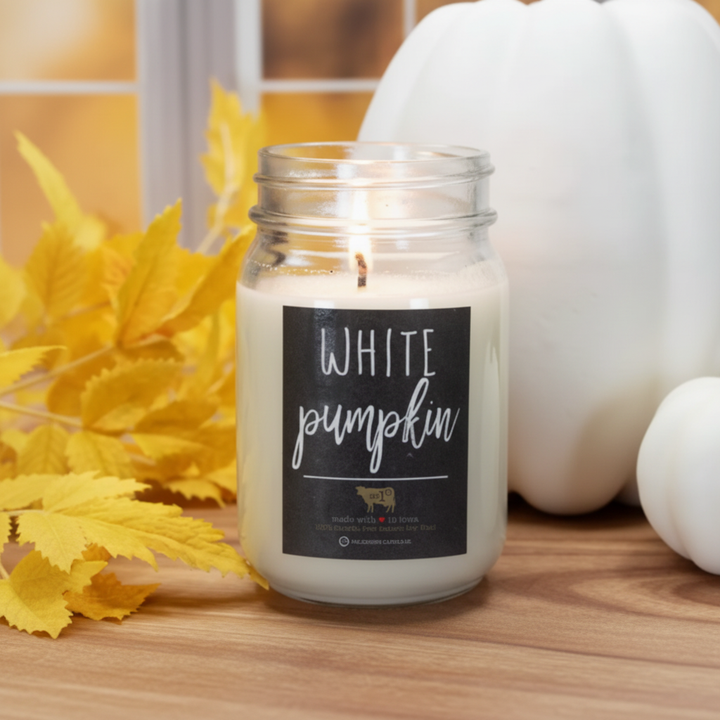 Milkhouse white pumpkin soy beeswax 13oz mason jar candle on warm rustic wooden table lifestyle product photography