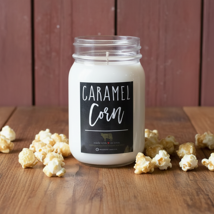 Milkhouse fall bakery caramel corn 13oz mason jar candle on warm rustic wooden table lifestyle product photography