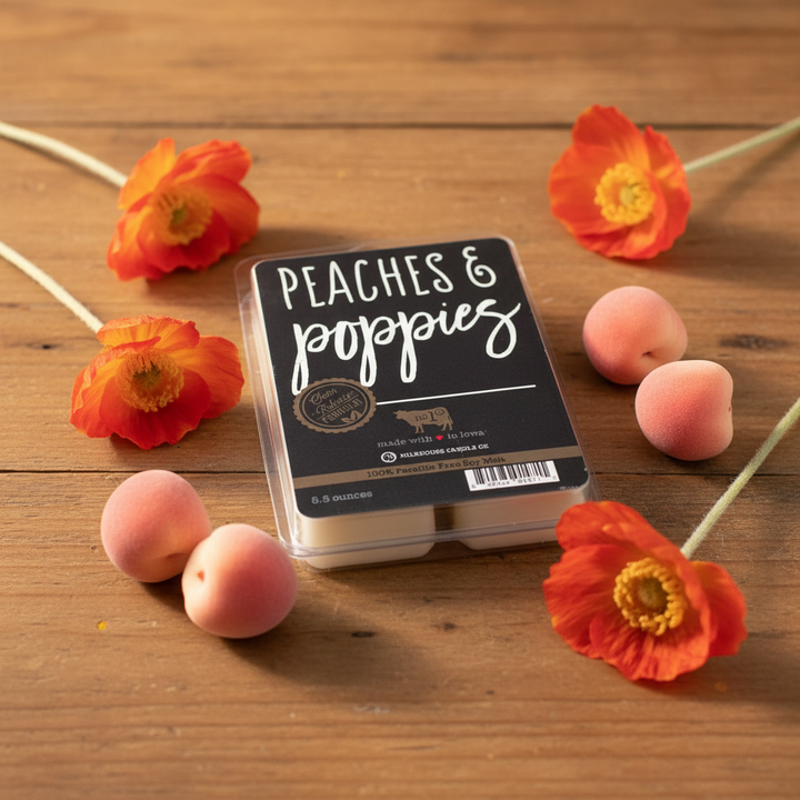 Milkhouse peaches and poppies 5.5oz wax melt on warm rustic wooden table lifestyle product photography