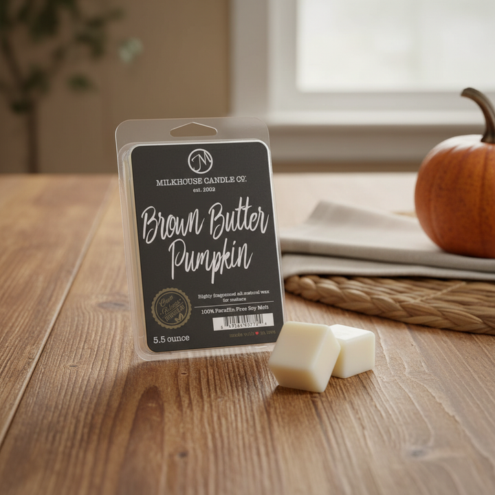 Milkhouse brown butter pumpkin 5.5oz wax melt on warm rustic wooden table lifestyle product photography