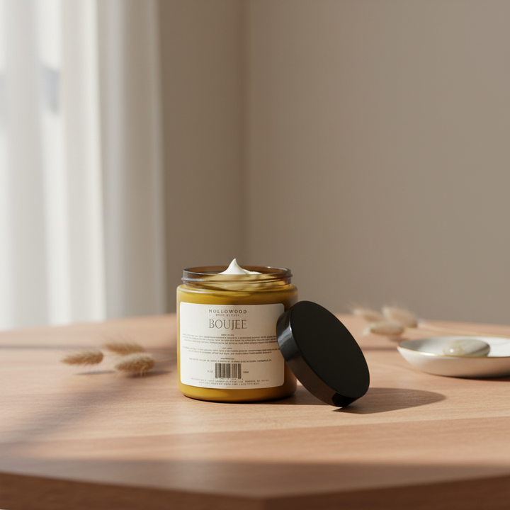 Boujee 10 oz Body Butter on warm wood table with soft neutral background