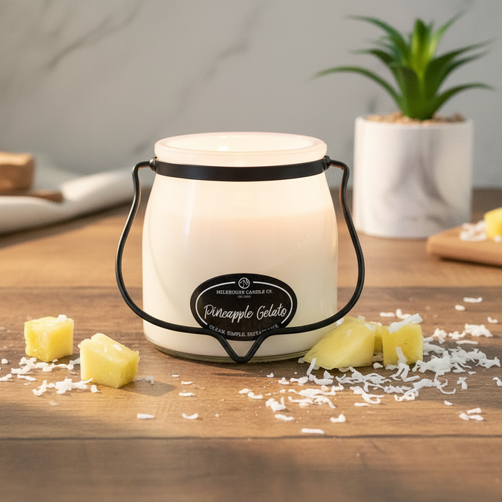 Milkhouse pineapple gelato 16oz butter jar candle on warm rustic wooden table lifestyle product photography