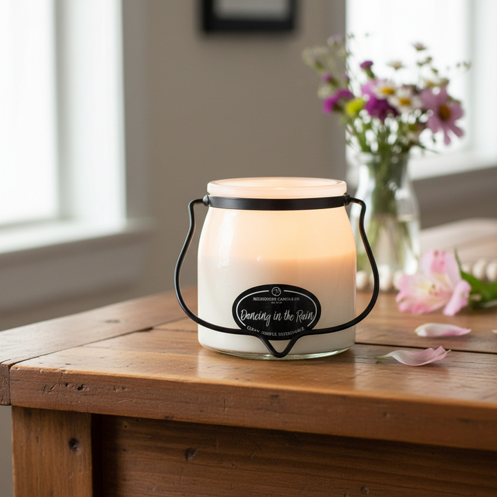 Milkhouse fresh rain 16oz butter jar candle on warm rustic wooden table lifestyle product photography