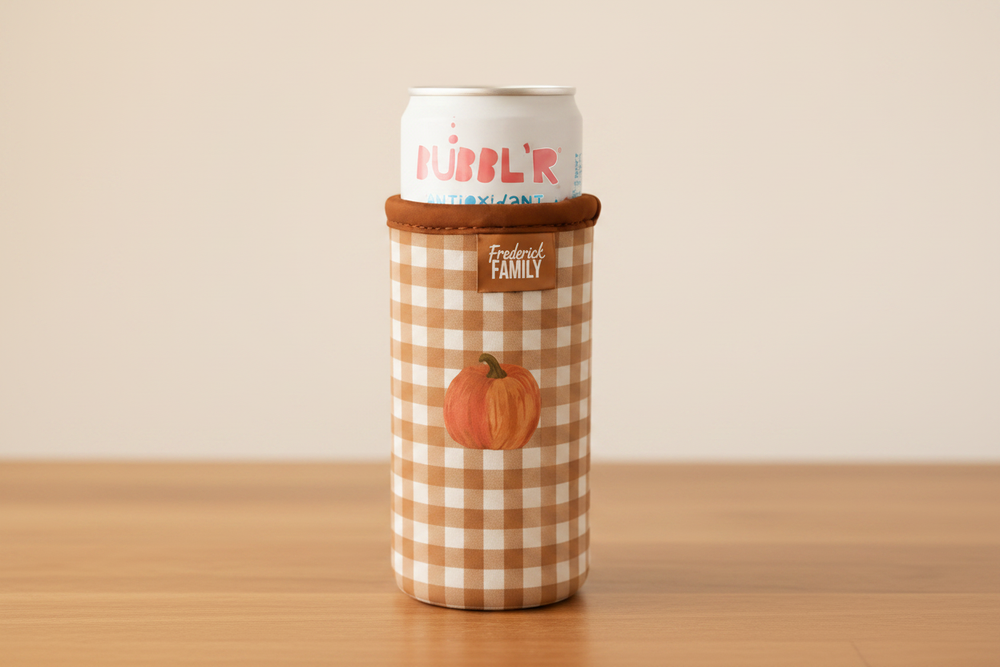 Pumpkin Gingham Koozie on warm wood